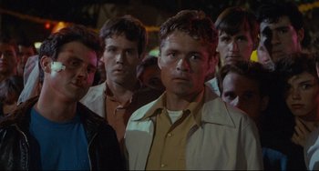 Movie still from “Porky's” (1981), directed by Bob Clark – A group of men standing next to each other in a crowd; Close Up shot, Low angle