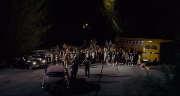 Movie still from “Porky's” (1981), directed by Bob Clark – A group of people standing in the middle of a street; Extreme Wide shot, High angle
