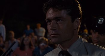 Movie still from “Porky's” (1981), directed by Bob Clark – A person wearing a suit and tie; Close Up shot, Low angle