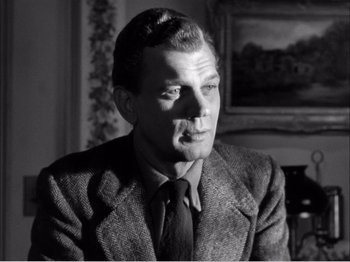 Movie still from “Portrait of Jennie” (1948), directed by William Dieterle – An old photo of a man wearing a suit and tie; Close Up shot, Low angle