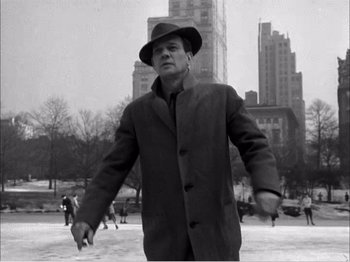 Movie still from “Portrait of Jennie” (1948), directed by William Dieterle – A black and white photo of a man in a hat; Medium shot, Low angle