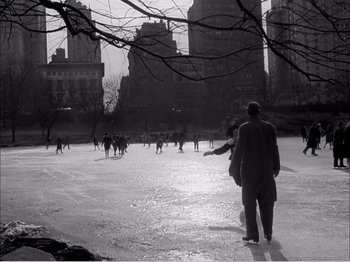 Movie still from “Portrait of Jennie” (1948), directed by William Dieterle – A group of people skating on a frozen pond; Extreme Wide shot, High angle
