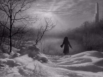 Movie still from “Portrait of Jennie” (1948), directed by William Dieterle – A person is walking through the snow on skis; Extreme Wide shot, High angle