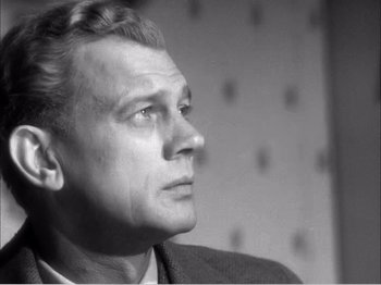Movie still from “Portrait of Jennie” (1948), directed by William Dieterle – An older man is looking off into the distance; Close Up shot, Low angle