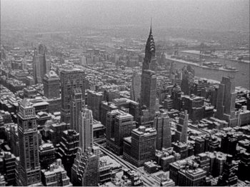 Movie still from “Portrait of Jennie” (1948), directed by William Dieterle – An aerial view of a large city in the middle of the day; Extreme Wide shot, High angle
