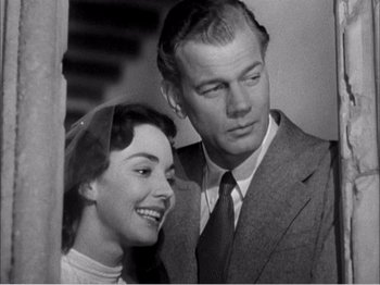 Movie still from “Portrait of Jennie” (1948), directed by William Dieterle – An old photo of a man and a woman looking at each other; Close Up shot, Low angle