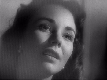 Movie still from “Portrait of Jennie” (1948), directed by William Dieterle – A black - and - white photo of a woman's face; Close Up shot, Low angle