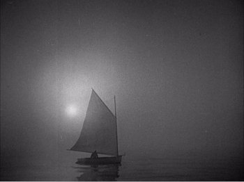 Movie still from “Portrait of Jennie” (1948), directed by William Dieterle – A sailboat in the middle of the night on the water; Extreme Wide shot, High angle