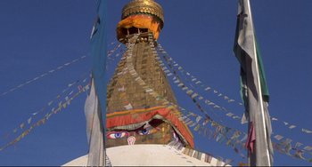 Movie still from “Powaqqatsi” (1988), directed by Godfrey Reggio – View of the top part of a building; Extreme Close Up shot, Low angle