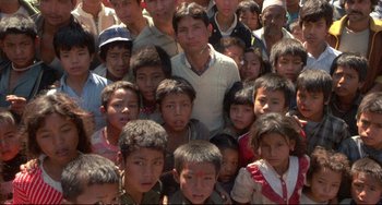 Movie still from “Powaqqatsi” (1988), directed by Godfrey Reggio – A large group of people are gathered together for a picture; Medium shot, High angle