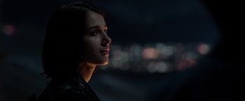 Movie still from “Power Rangers” (2017), directed by Dean Israelite – A woman is looking into the distance in the dark; Close Up shot, Low angle