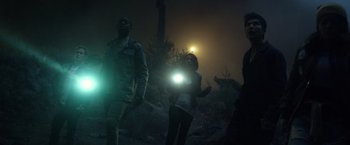 Movie still from “Power Rangers” (2017), directed by Dean Israelite – A group of people standing on top of a hill at night; Medium shot, Low angle
