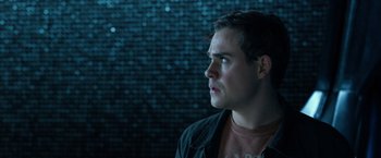 Movie still from “Power Rangers” (2017), directed by Dean Israelite – A young man looking to his left in front of a brick wall; Close Up shot, Over the shoulder angle