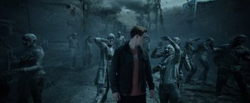 Movie still from “Power Rangers” (2017), directed by Dean Israelite – A group of zombies walking through a dark city; Wide shot, Over the shoulder angle