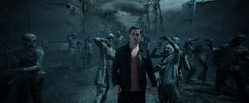 Movie still from “Power Rangers” (2017), directed by Dean Israelite – A man standing in front of a group of zombies; Medium shot, Over the shoulder angle