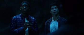 Movie still from “Power Rangers” (2017), directed by Dean Israelite – Two young men standing next to each other in the dark; Close Up shot, Low angle