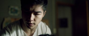 Movie still from “Power Rangers” (2017), directed by Dean Israelite – A young man is looking at the camera; Close Up shot, Over the shoulder angle