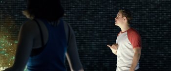 Movie still from “Power Rangers” (2017), directed by Dean Israelite – Two people standing in front of each other in a dark room; Medium shot, Over the shoulder angle