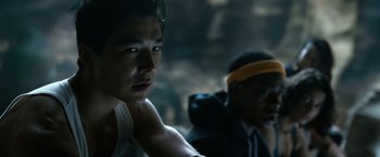 Movie still from “Power Rangers” (2017), directed by Dean Israelite – A man in a white tank top and a man in a black shirt; Close Up shot, Over the shoulder angle