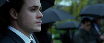 Movie still from “Power Rangers” (2017), directed by Dean Israelite – A person holding an open umbrella; Close Up shot, Over the shoulder angle