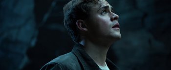 Movie still from “Power Rangers” (2017), directed by Dean Israelite – A young man looking up into the air; Close Up shot, Low angle