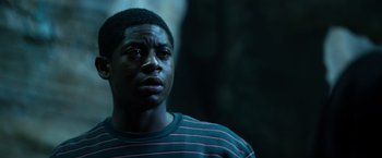 Movie still from “Power Rangers” (2017), directed by Dean Israelite – A young man is looking up at the sky; Close Up shot, Low angle