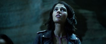 Movie still from “Power Rangers” (2017), directed by Dean Israelite – A woman wearing a black leather jacket looking up; Close Up shot, Low angle