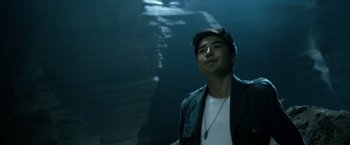 Movie still from “Power Rangers” (2017), directed by Dean Israelite – A man standing in the dark with his eyes wide open; Close Up shot, Low angle