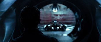 Movie still from “Power Rangers” (2017), directed by Dean Israelite – A man is looking at a face in the dark; Close Up shot, Over the shoulder angle