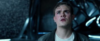 Movie still from “Power Rangers” (2017), directed by Dean Israelite – A young man looking up into the air; Close Up shot, Low angle