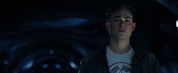 Movie still from “Power Rangers” (2017), directed by Dean Israelite – A man in a leather jacket looking to his left; Close Up shot, Low angle