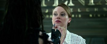 Movie still from “Power Rangers” (2017), directed by Dean Israelite – A woman putting makeup on her face in front of a mirror; Close Up shot, Over the shoulder angle