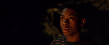 Movie still from “Power Rangers” (2017), directed by Dean Israelite – A young man is looking into the distance; Close Up shot, Low angle