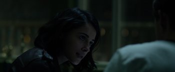 Movie still from “Power Rangers” (2017), directed by Dean Israelite – A young woman is sitting in a dark room; Close Up shot, Over the shoulder angle