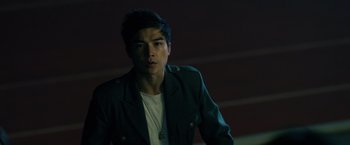 Movie still from “Power Rangers” (2017), directed by Dean Israelite – A man in a jacket and a white t - shirt; Close Up shot, Over the shoulder angle