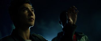Movie still from “Power Rangers” (2017), directed by Dean Israelite – A man and a woman standing next to each other in the dark; Close Up shot, Low angle