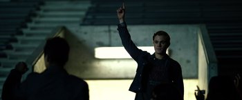 Movie still from “Power Rangers” (2017), directed by Dean Israelite – A man is pointing up in the dark; Medium shot, Low angle