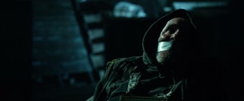 Movie still from “Power Rangers” (2017), directed by Dean Israelite – A man with duct tape around his mouth; Close Up shot, Over the shoulder angle