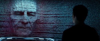 Movie still from “Power Rangers” (2017), directed by Dean Israelite – A man is standing in front of a computer screen; Close Up shot, Over the shoulder angle