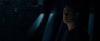 Movie still from “Power Rangers” (2017), directed by Dean Israelite – A man is looking up at the ceiling lights; Close Up shot, Over the shoulder angle