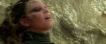 Movie still from “Power Rangers” (2017), directed by Dean Israelite – A woman with a snake around her neck; Close Up shot, Overhead angle