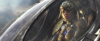 Movie still from “Power Rangers” (2017), directed by Dean Israelite – A woman dressed in a gold costume with wings; Medium shot, Low angle