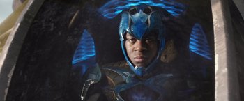 Movie still from “Power Rangers” (2017), directed by Dean Israelite – A man wearing a blue and black helmet; Close Up shot, Low angle