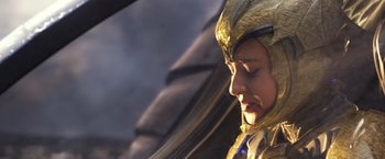 Movie still from “Power Rangers” (2017), directed by Dean Israelite – A woman in a gold and black costume looking to her left; Close Up shot, Low angle