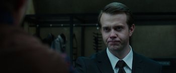 A person wearing a suit and tie