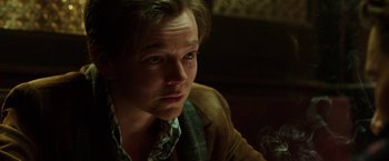 Movie still from “Predestination” (2014), directed by Michael Spierig – A person with a cigarette in his mouth; Close Up shot, Low angle