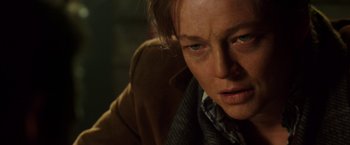 Movie still from “Predestination” (2014), directed by Michael Spierig – A person with blue eyes looking at the camera; Close Up shot, Low angle
