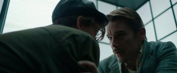 Movie still from “Predestination” (2014), directed by Michael Spierig – A man and a woman looking at one another in a room; Close Up shot, Over the shoulder angle