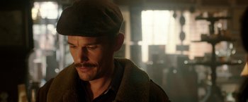 Movie still from “Predestination” (2014), directed by Michael Spierig – A person wearing a hat; Close Up shot, Over the shoulder angle