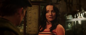 Movie still from “Predestination” (2014), directed by Michael Spierig – A person with long black hair; Close Up shot, Over the shoulder angle